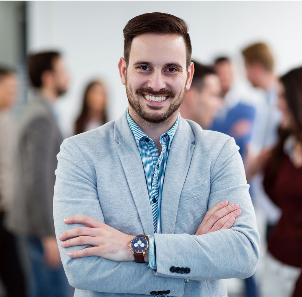 group picture of businessman posing in office ZKA6TFS